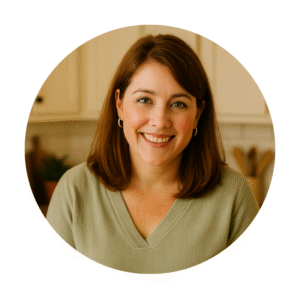 Emma Blake smiling and holding a freshly baked casserole in her kitchen