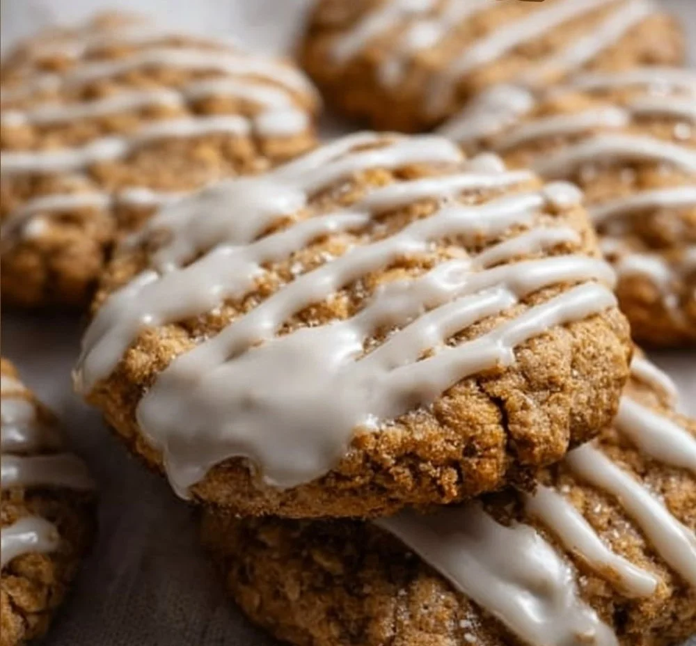 Iced oatmeal cookies with a creamy icing on a decorative plate