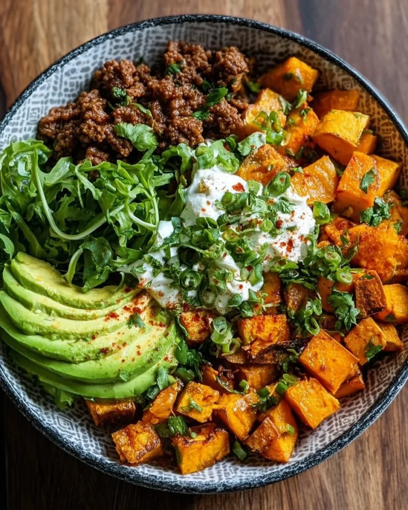 Delicious sweet potato taco bowl with fresh toppings and vibrant ingredients.