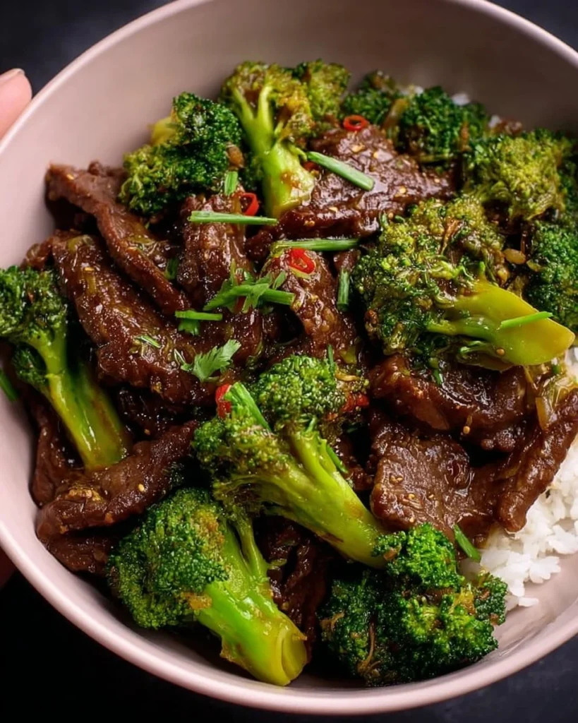Beef and Broccoli Stir-Fry served in a bowl with rice and vegetables