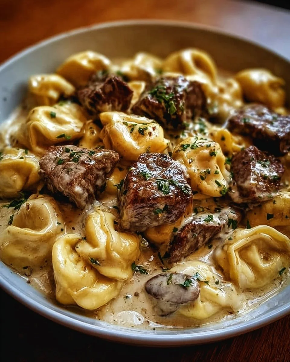 Cracked garlic steak tortellini served in creamy sauce