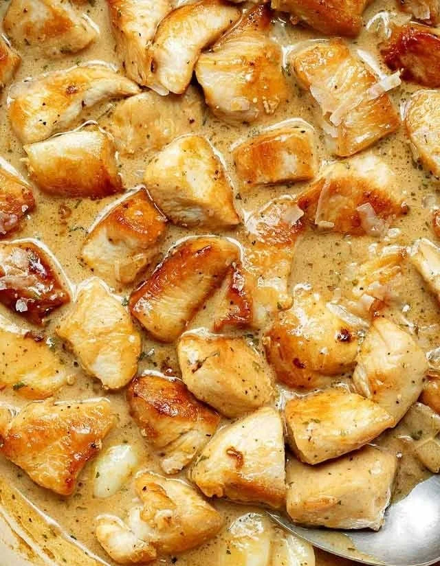 Delicious creamy chicken bites served on a platter.