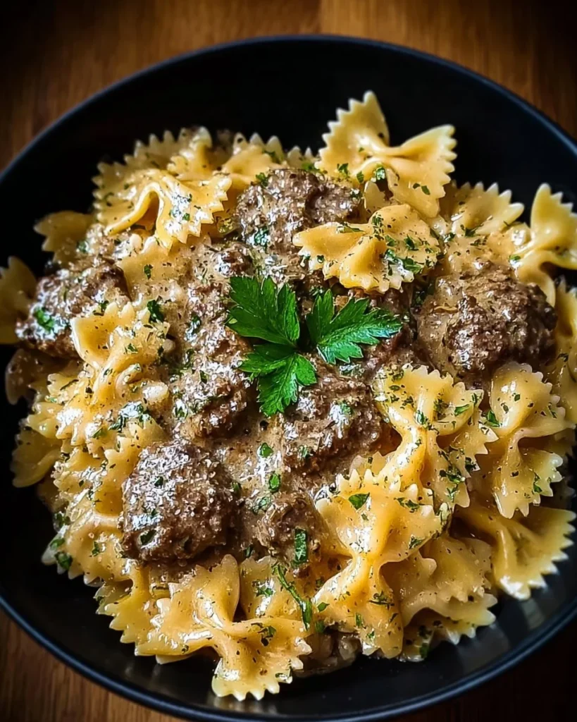 Creamy parmesan garlic beef bowtie pasta served in a bowl