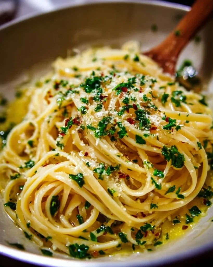 Delicious Italian pasta served with garlic olive oil sauce in a bowl.