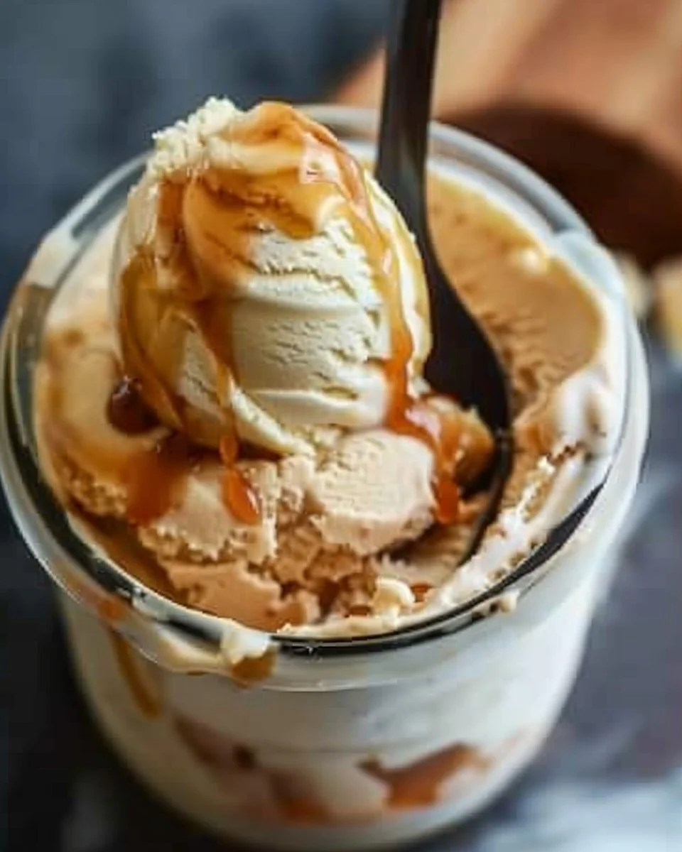Ninja Creami Salted Caramel Protein Ice Cream 1 Bowl of Ninja Creami salted caramel protein ice cream topped with caramel drizzle.