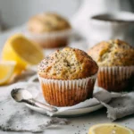 Freshly baked easy lemon poppyseed muffins on a kitchen counter