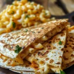 Mac and Cheese Quesadillas served with dipping sauce on a plate