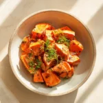 Colorful and nutritious sweet potato salad featuring fresh vegetables and dressing